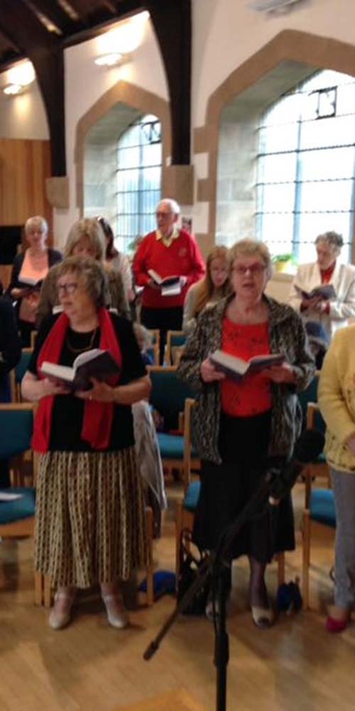 The congregation dressed in flame colours to remind us that we are Pentecost PeopleTall